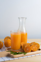 fresh squeezed orange juice on wood table
