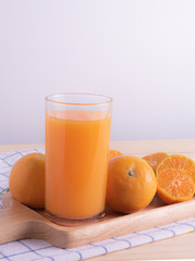 fresh squeezed orange juice on wood table