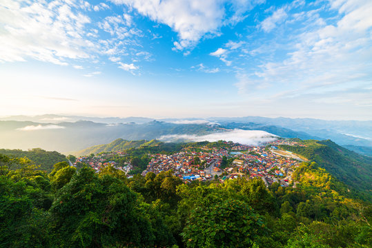 Aerial view of Phongsali, North Laos near China. Yunnan style town on scenic mountain ridge. Travel destination for tribal trekking in Akha villages. Fog and mist in the valley.