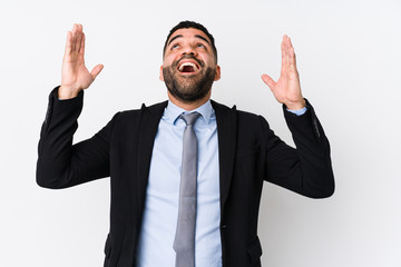 Young latin business woman against a white background isolated screaming to the sky, looking up, frustrated.