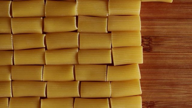 Stop motion background animation with rigatoni on chopping block