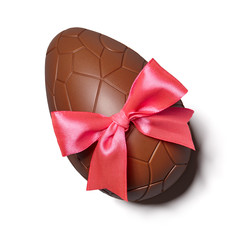 Chocolate Easter egg with pink ribbon bow