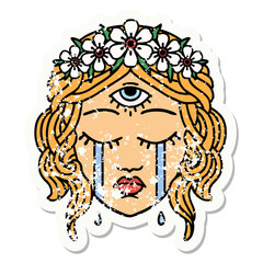 traditional distressed sticker tattoo of female face with third eye crying