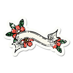 traditional distressed sticker tattoo of a banner and flowers