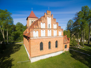 Aerial view of red brick church in Kuty, Mazury, Poland (former Kutten, East Prussia)