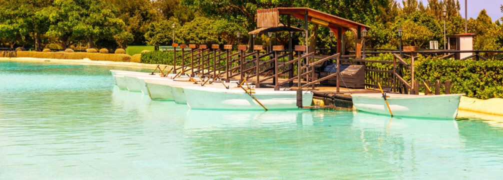 A beautiful place in a city park with water and moored white boats, a perfect place for a romantic time for couples and honeymooners