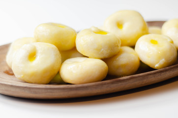 Traditional Silesian dumplings with a hole,  homemade noodles served with butter