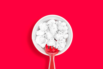 Concept of not junk food, not sugar drink soda, fast food and unhealthy concept. Crumpled paper ball on paper cup over red background.