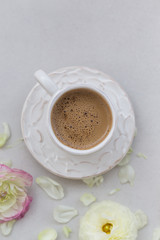 A cup of coffee over light gray background