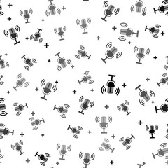 Black Microphone icon isolated seamless pattern on white background. On air radio mic microphone. Speaker sign. Vector Illustration