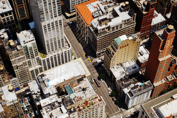 Manhattan midtown top view with big skyscrapers, New York City, USA. Top of the buildings in financial district, NYC panorama. Business background. Down streets view.