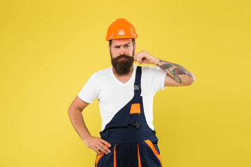 Improvement and renovation. Brutal man builder. Engineer builder in uniform. Man builder hard hat. Handyman at workshop. Creativity and practice. Polished approach. Craftsman keep head safe in helmet