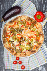 pizza with eggplant, zucchini, sweet pepper, mozzarella cheese and tomato sauce