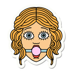 tattoo style sticker of female face with ball gag