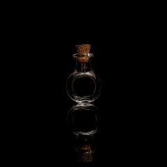 Glass test tubes with liquid isolated on a black background.