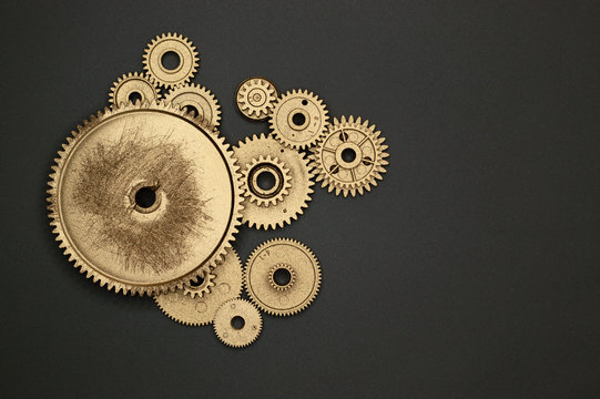 golden gears on gray background