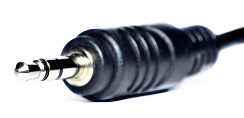 Close-up of 3.5mm jack connector isolated on white background.