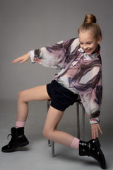 Child-girl with long hair gathered in a bun