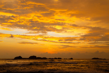 Fototapeta na wymiar Tropical sunset on the beach. Hikkaduwa Sri Lanka.
