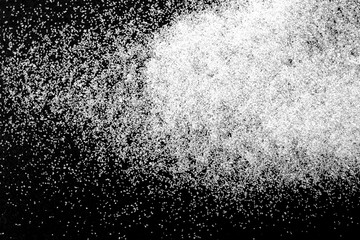 Abstract wallpaper design of white color shiny snow dust powder isolated on black background