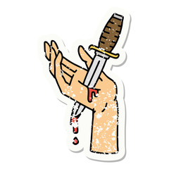 traditional distressed sticker tattoo of a dagger in the hand