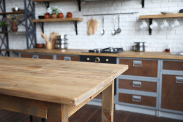 Empty wooden table in beautiful kitchen. Interior design