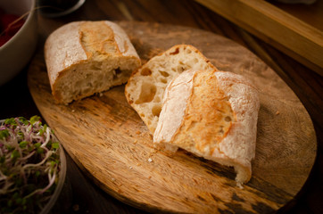 pieces of ciabatta on a wooden board