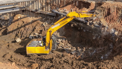Yellow jackhammer machine on a construction site timelapse