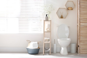 Fototapeta na wymiar Modern toilet bowl in stylish bathroom interior