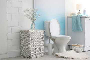 Modern toilet bowl in stylish bathroom interior