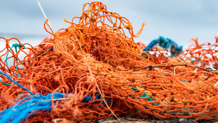Fishing nets from industrial fishing on the beach as waste