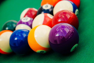 Billiard balls on green pool table, snooker, pool game. billiards. Pyramid of pool billiard balls...