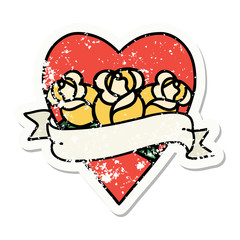traditional distressed sticker tattoo of a heart and banner with flowers
