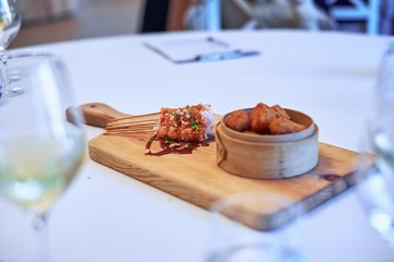ham croquettes and shrimp on a table