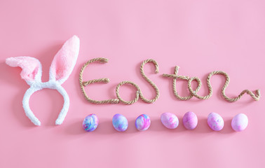 Easter creative inscription on a pink background .
