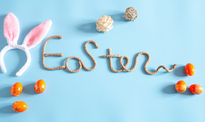 Easter creative inscription on a blue background.