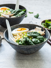 Vegetarian Miso Ramen with Mushrooms, raw Spinach and boiled Egg in blue bowl
