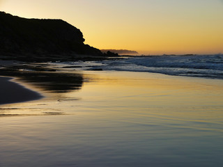 Fototapeta na wymiar fisherman's on the beach at sunrise - Garden Route, South Africa