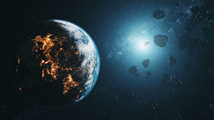 black asteroids fly by illuminated realistic planet Earth at blue star light in outer space. 3d animation. Science and technology concept. Elements of this product furnished by NASA