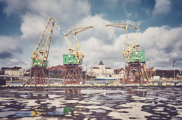 Port cranes on Szczecin Lasztownia island, color toning applied, Poland. © MaciejBledowski