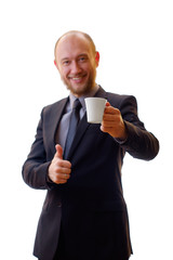 Businessman in a black suit holding a cup of aromatic coffee or refreshing tea. Man drinking black coffee. Breakfast or lunch break. Inhale the aroma of coffee or a refreshing drink tea.