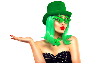 St. Patrick's Day leprechaun model girl in green hat, funny clover sunglasses holding product,...