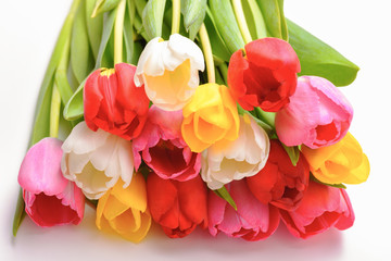 Bouquet of fresh, bright, multi-colored tulips on a white background, isolated.