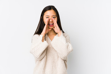 Fototapeta premium Young chinese woman isolated shouting excited to front.