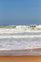 Ocean coast, moviment waves with foam. Wind power. Turquoise water.