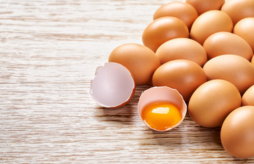 fresh eggs on a white wooden table, top view.