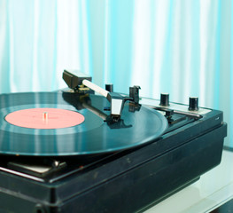 Fototapeta na wymiar Old turntable. Nice memories. Retro style. Youth of parents. The best years.