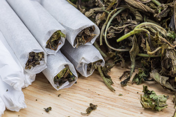 Marijuana on wood table.