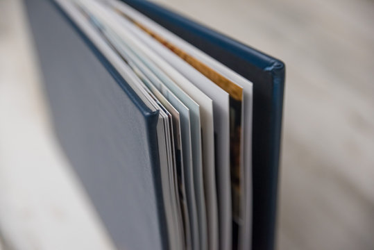 Side View Close Up Of Thick And Rigid Wedding Album Pages In A Book