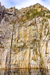 In front of a mountain wall in the Lysefjord, Rogaland, Norway